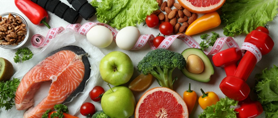 healthy food and red dumbbells on white table 2026 09 22 03 32 26 utc